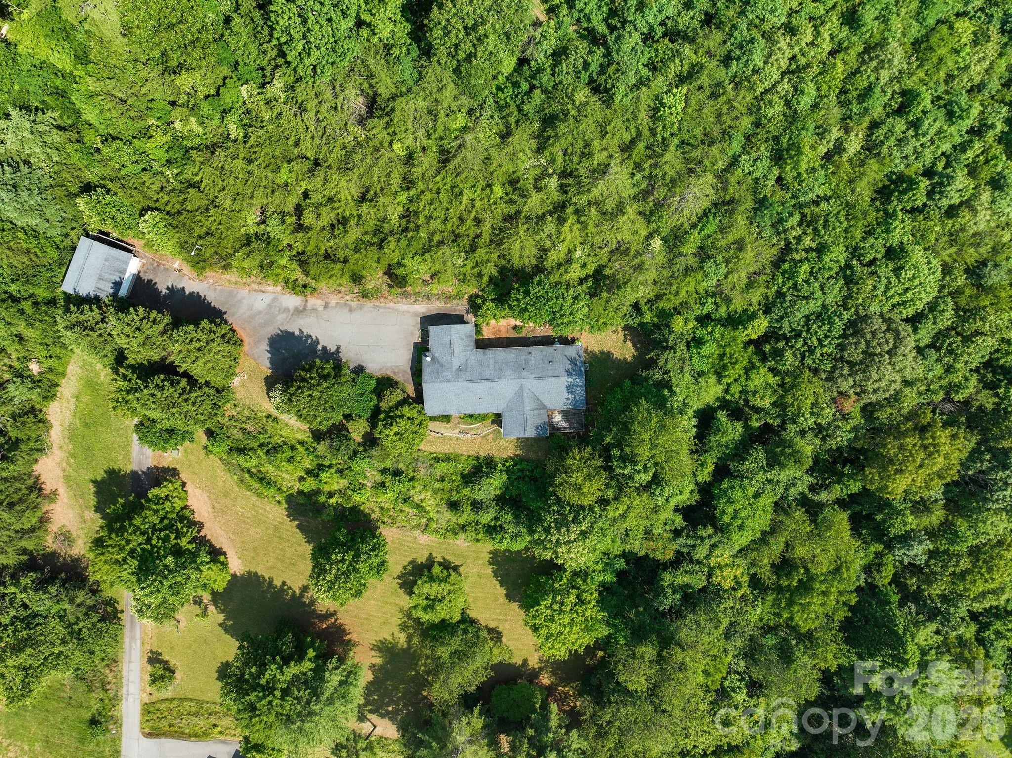 133 Spivey Mountain Road Asheville, NC 28806 - Photo 36 of 40 an aerial view of a house with a yard