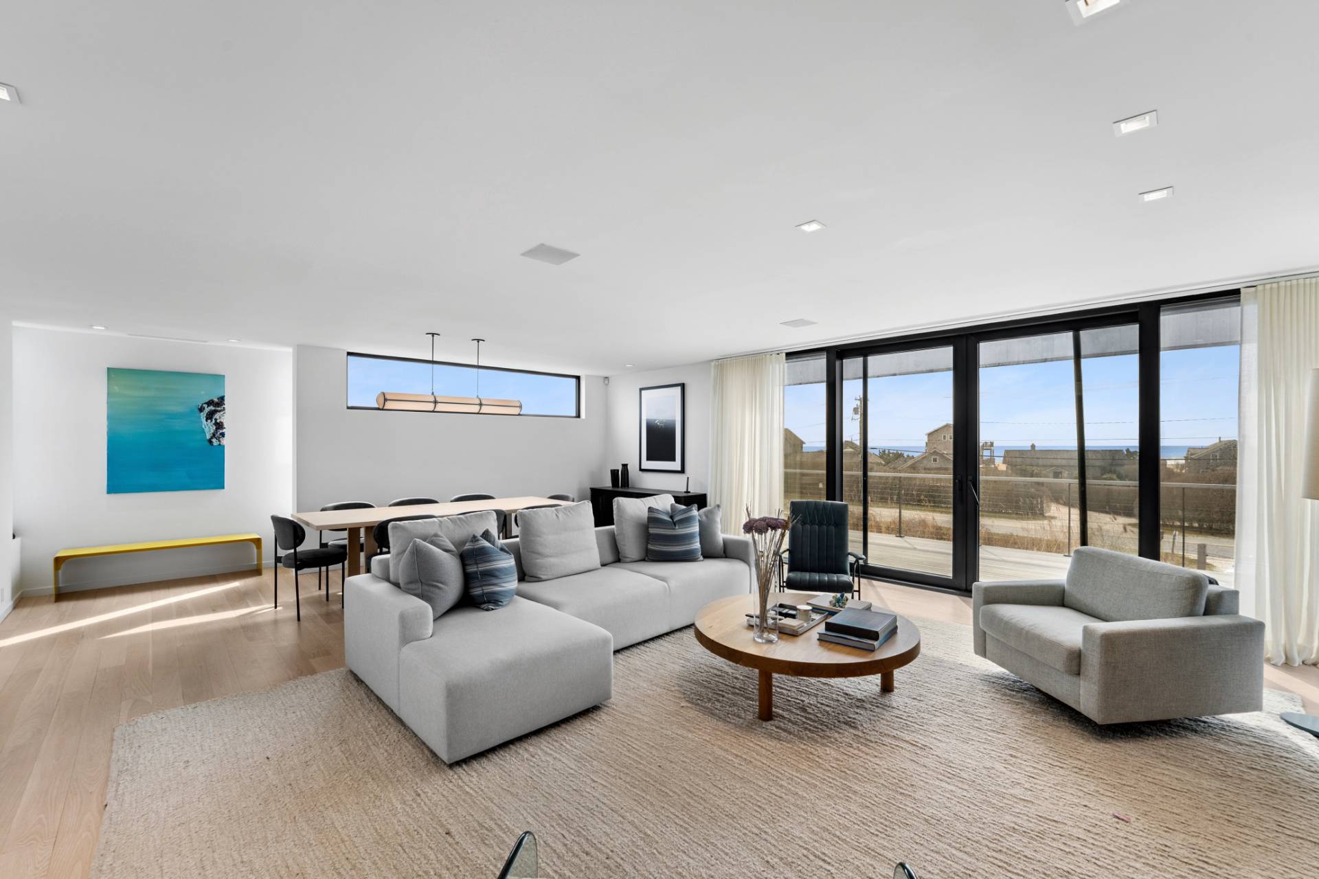 15 Deforest Road Montauk, NY 11954 - Photo 5 of 22 a living room with furniture and a floor to ceiling window
