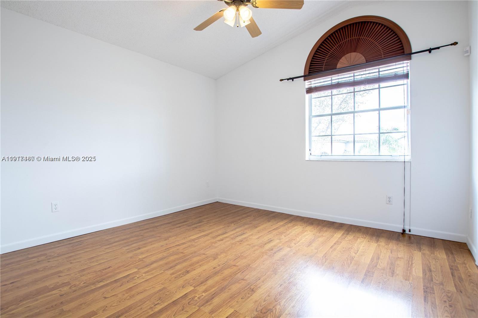 16227 Southwest 139th Court, Unit 2 Miami, FL 33177 - Photo 5 of 10 an empty room with a window