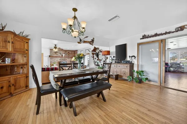 a view of kitchen with furniture and wooden floor
