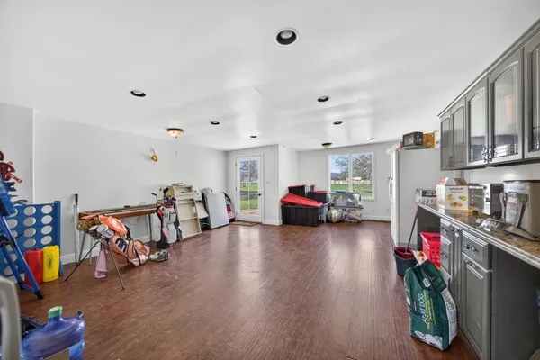 a bedroom with furniture and a flat screen tv