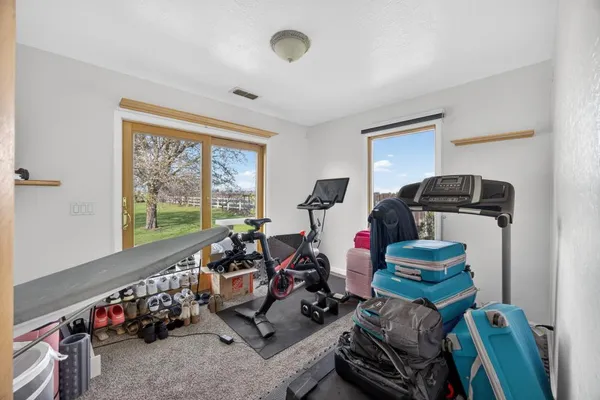 a view of a house with basketball court