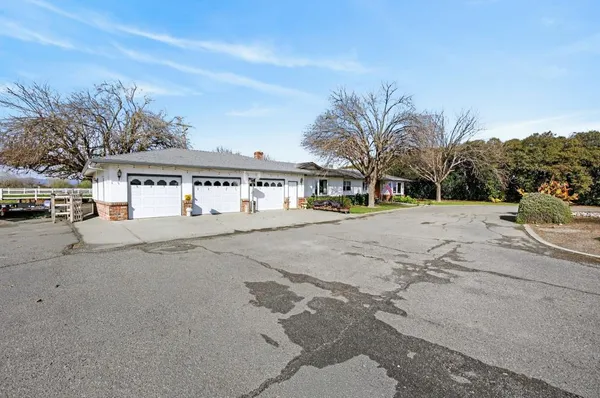 a bedroom with furniture and a flat screen tv