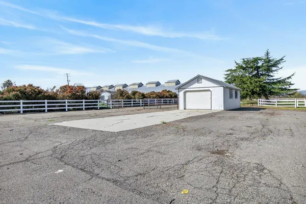 a bedroom with furniture and a wooden floor