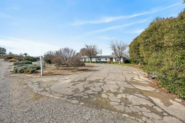 a view of a livingroom with wooden floor and a window