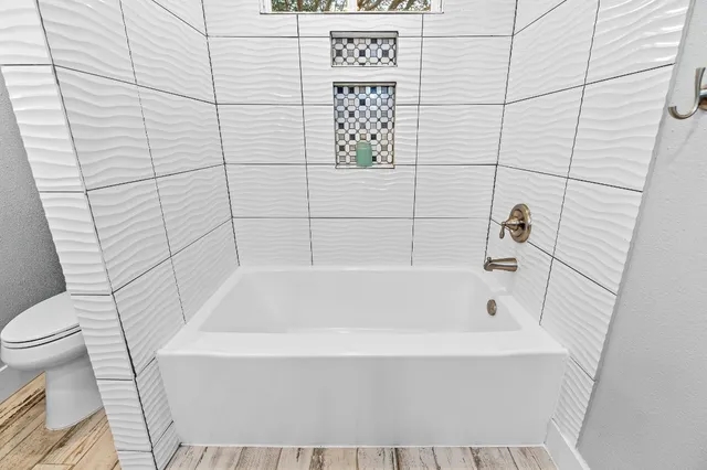 a bathroom with a bathtub