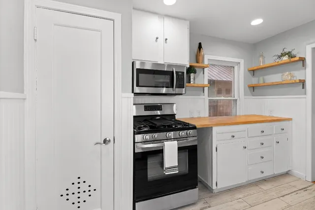 a kitchen with a stove and a microwave