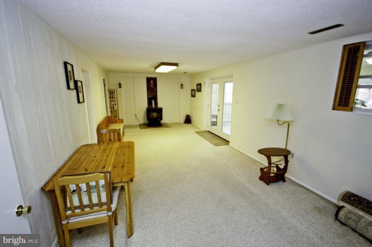 8245 Rupert Road South Millersville, MD 21108 - Photo 12 of 30 a living room with furniture and a window