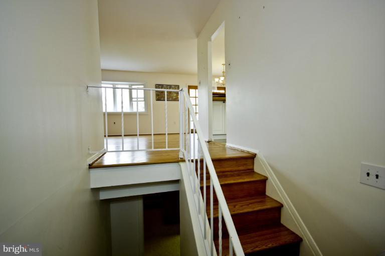 8245 Rupert Road South Millersville, MD 21108 - Photo 16 of 30 a view of stairs and an empty room