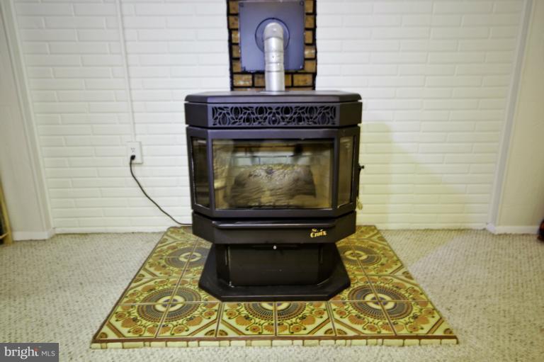 8245 Rupert Road South Millersville, MD 21108 - Photo 24 of 30 a living room with fireplace
