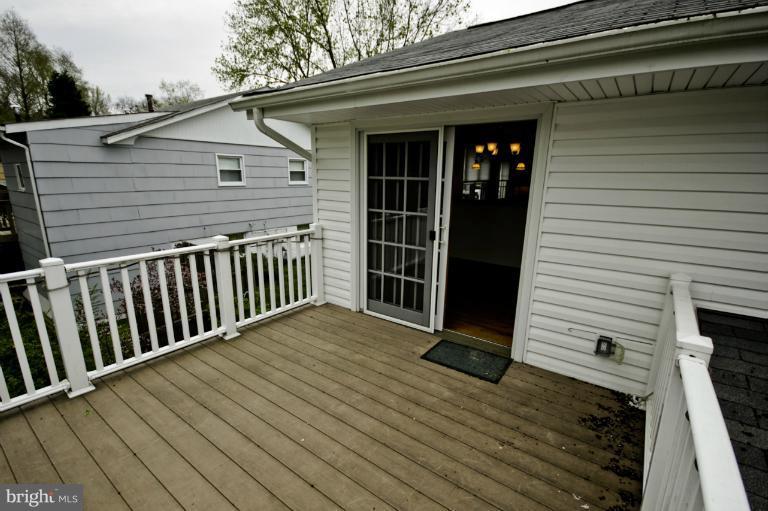 8245 Rupert Road South Millersville, MD 21108 - Photo 25 of 30 a view of a house with a deck