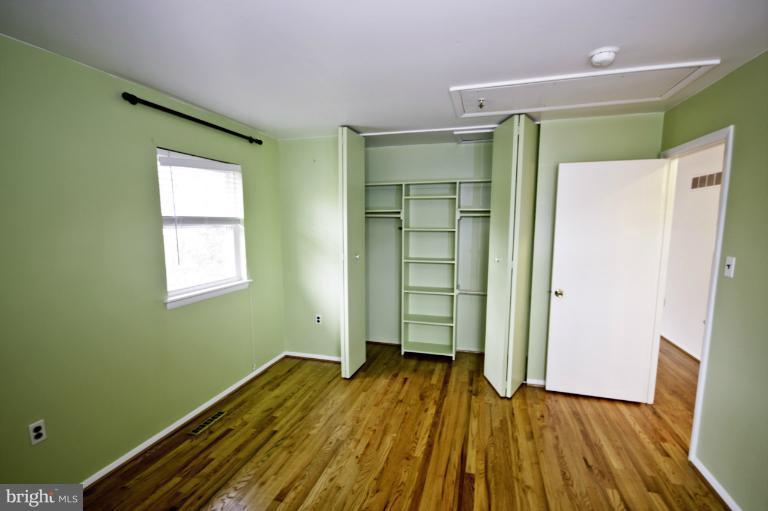 8245 Rupert Road South Millersville, MD 21108 - Photo 7 of 30 a view of a room with wooden floor and a window