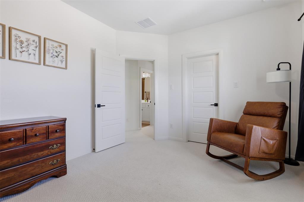 15413 Short Rdg Lane Fort Worth, TX 76008 - Photo 26 of 39 Carpeted room featuring white walls and white five-panel interior doors with matte black hardware