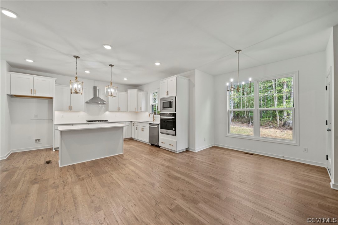 8506 Freebridge Road Chesterfield, VA 23832 - Photo 12 of 37 a large kitchen with kitchen island a sink stainless steel appliances and cabinets
