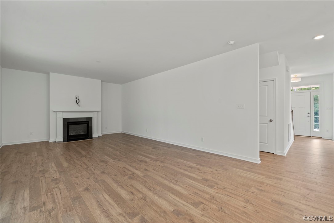 8506 Freebridge Road Chesterfield, VA 23832 - Photo 14 of 37 a view of empty room with wooden floor and fireplace