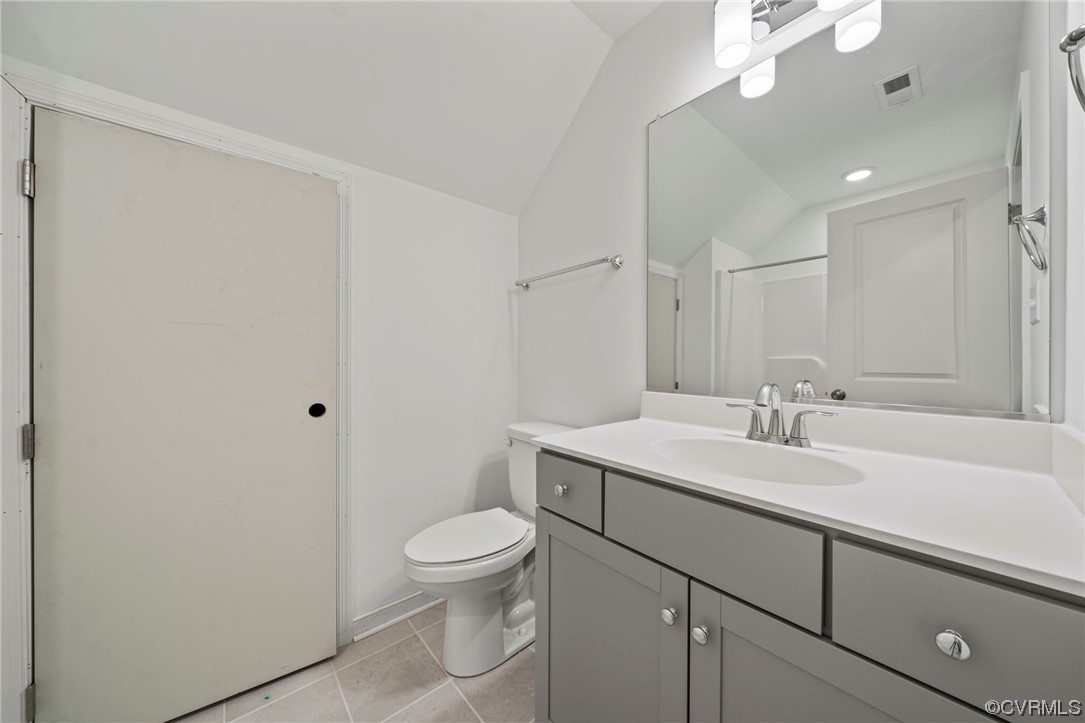 8506 Freebridge Road Chesterfield, VA 23832 - Photo 18 of 37 a bathroom with a toilet a sink a mirror and vanity