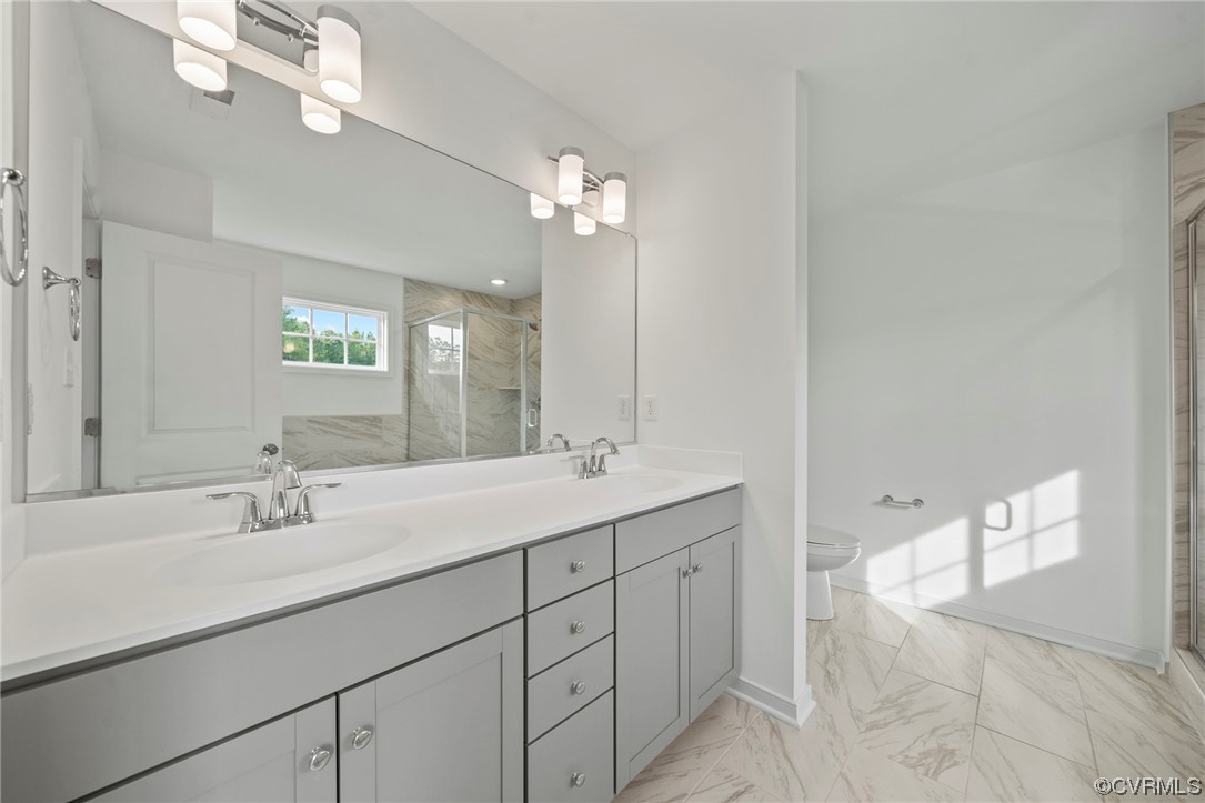 8506 Freebridge Road Chesterfield, VA 23832 - Photo 23 of 37 a bathroom with a double vanity sink and a mirror
