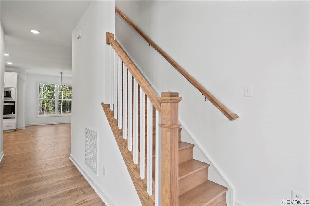 8506 Freebridge Road Chesterfield, VA 23832 - Photo 3 of 37 a view of staircase with wooden floor and white walls