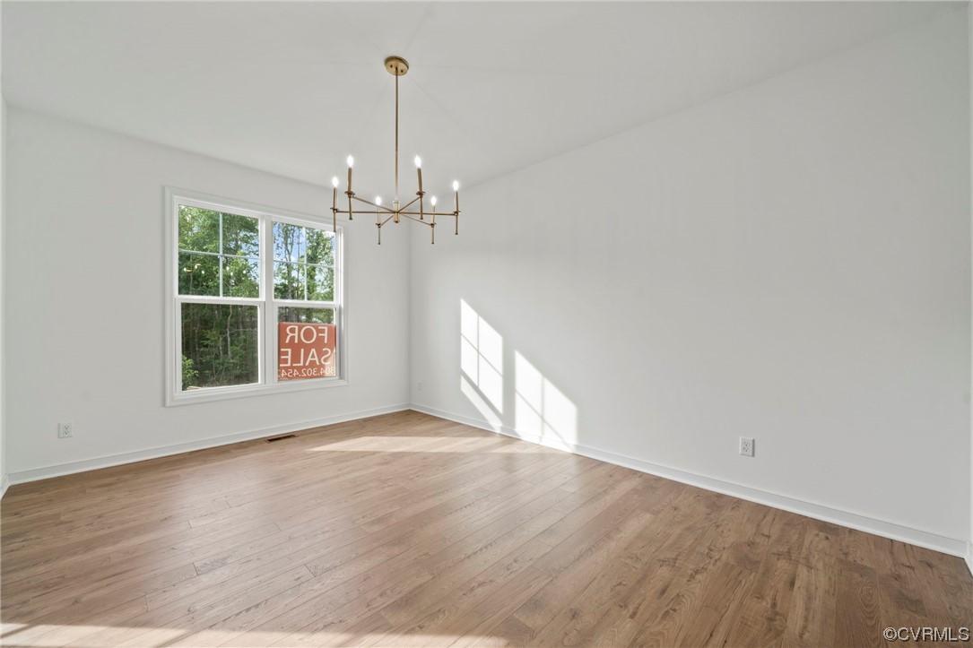 8506 Freebridge Road Chesterfield, VA 23832 - Photo 4 of 37 wooden floor in an empty room with a window