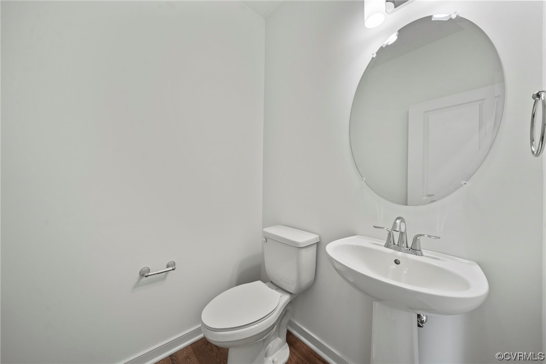 8506 Freebridge Road Chesterfield, VA 23832 - Photo 6 of 37 a bathroom with a toilet sink and mirror