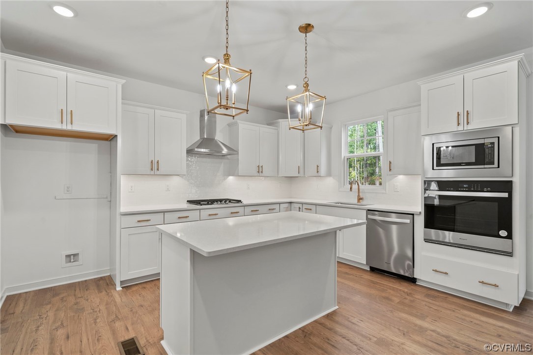 8506 Freebridge Road Chesterfield, VA 23832 - Photo 7 of 37 a kitchen with a stove a sink and a refrigerator