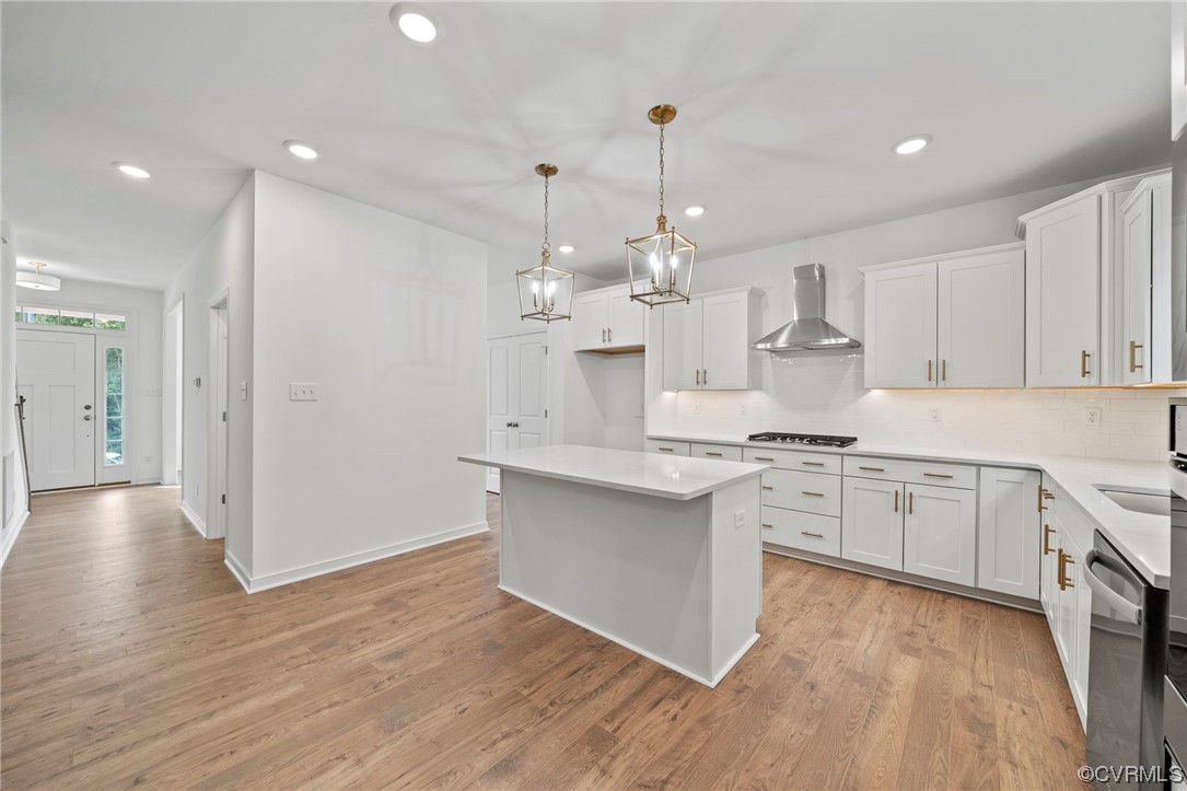 8506 Freebridge Road Chesterfield, VA 23832 - Photo 8 of 37 a large kitchen with granite countertop a stove top oven a sink dishwasher and a refrigerator with wooden floor