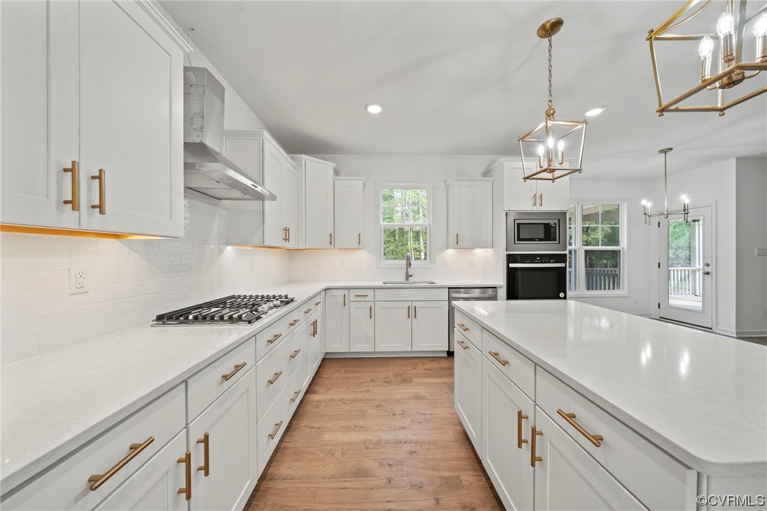 8506 Freebridge Road Chesterfield, VA 23832 - Photo 10 of 37 a large kitchen with granite countertop a white stove top oven and cabinets