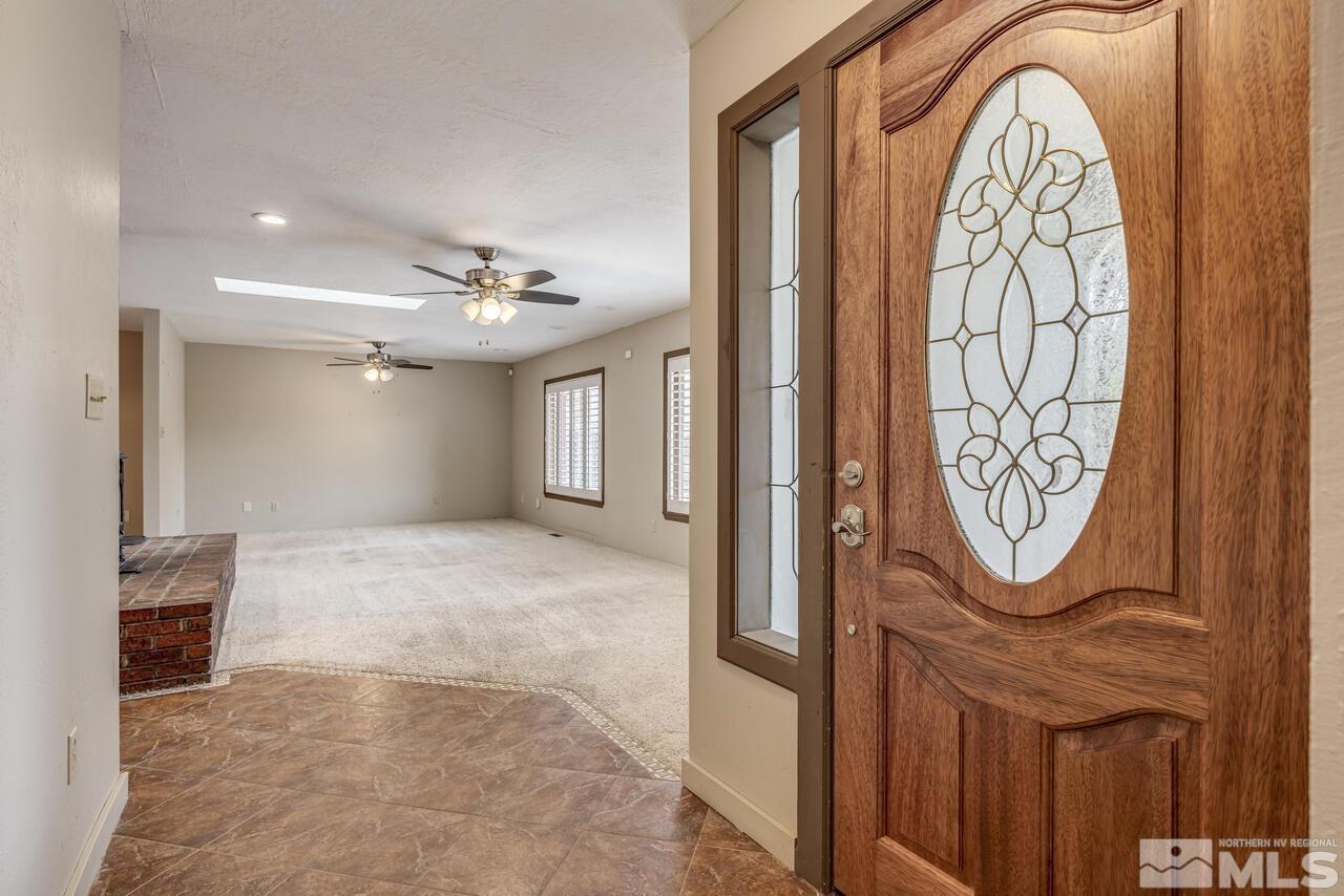 14340 Virginia Foothills Drive Reno, NV 89521 - Photo 3 of 24 a view of a entryway with furniture and a window