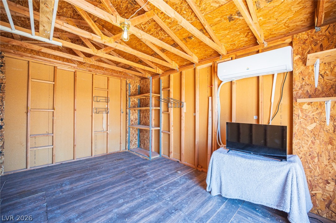 3200 Maple Road Pahrump, NV 89048 - Photo 45 of 53 A versatile storage space features exposed wooden beams and a modern cooling unit.