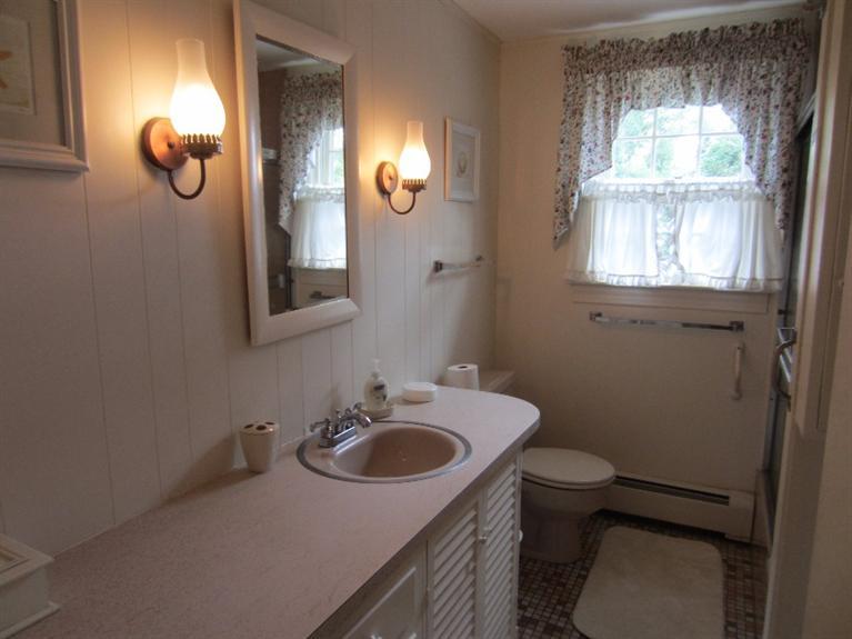 2 Trout Brook Road Harwich, MA 02645 - Photo 19 of 21 a bathroom with a sink vanity mirror and toilet