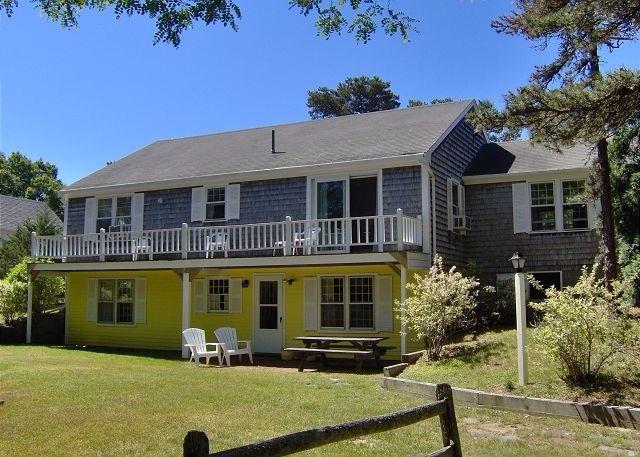 2 Trout Brook Road Harwich, MA 02645 - Photo 2 of 21 a front view of a house with swimming pool and glass windows