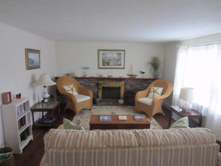 2 Trout Brook Road Harwich, MA 02645 - Photo 7 of 21 a living room with furniture and a fireplace