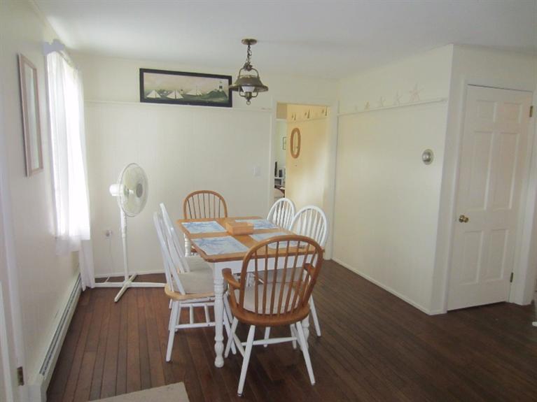 2 Trout Brook Road Harwich, MA 02645 - Photo 10 of 21 a view of a dining room with furniture window and wooden floor