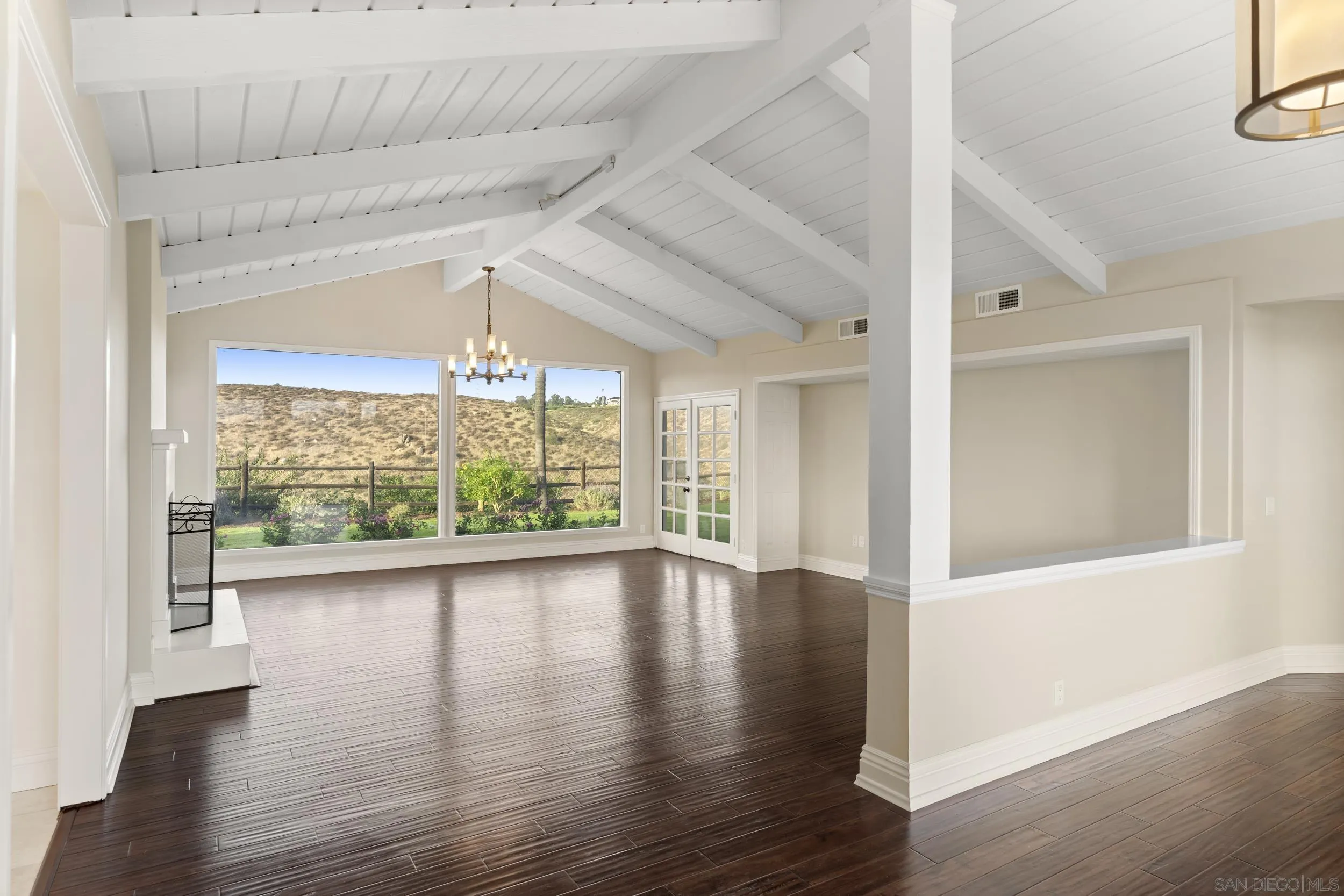 16551 Zumaque Street Rancho Santa Fe, CA 92067 - Photo 4 of 58 Formal entry into large living room with fireplace and french doors. Picture windows with peaceful views.
