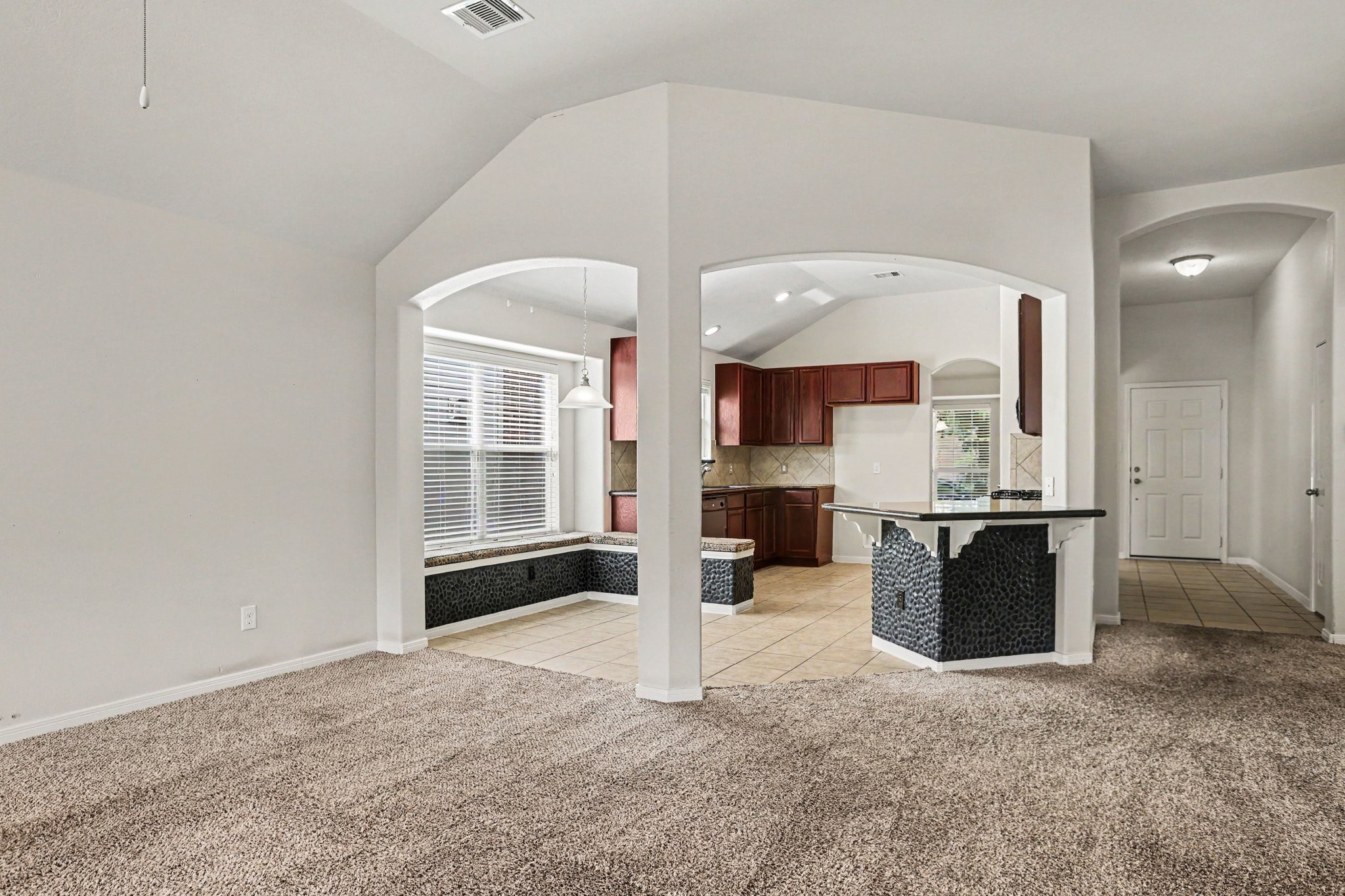 25222 Ginger Ranch Drive Katy, TX 77494 - Photo 13 of 33 The vaulted ceilings and arched entryways add elegance where the welcoming front entryway creates a great space for entertaining.