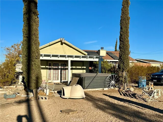 a front view of a house with outdoor seating