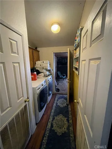 a storage room with a washer dryer and washer