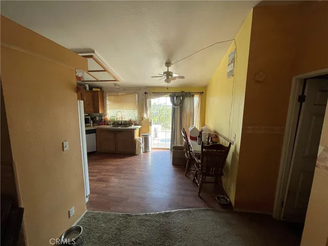 a view of a living room and kitchen with furniture and a view of kitchen