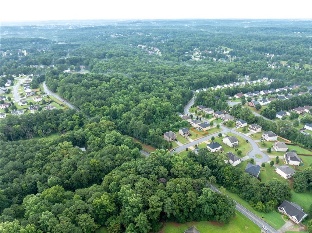 4225 Weelaunee Road Ellenwood, GA 30294 - Photo 14 of 15 an aerial view of residential houses with outdoor space and trees