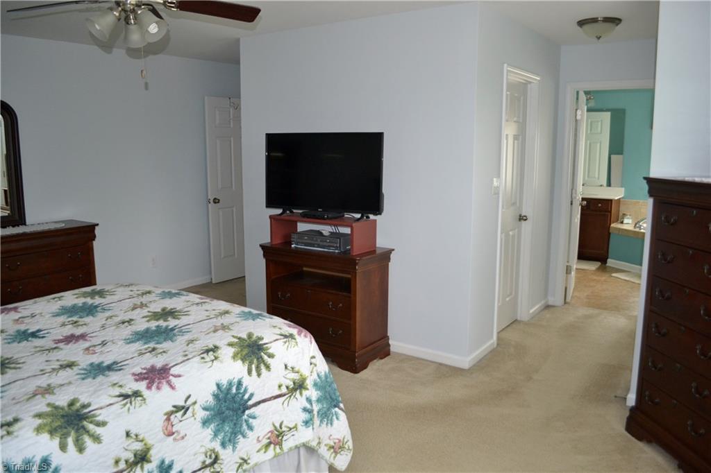 3068 Sycamore Point Trail High Point, NC 27265 - Photo 22 of 30 Master bedroom has 2 separate closets in this hallway leading to the en suite