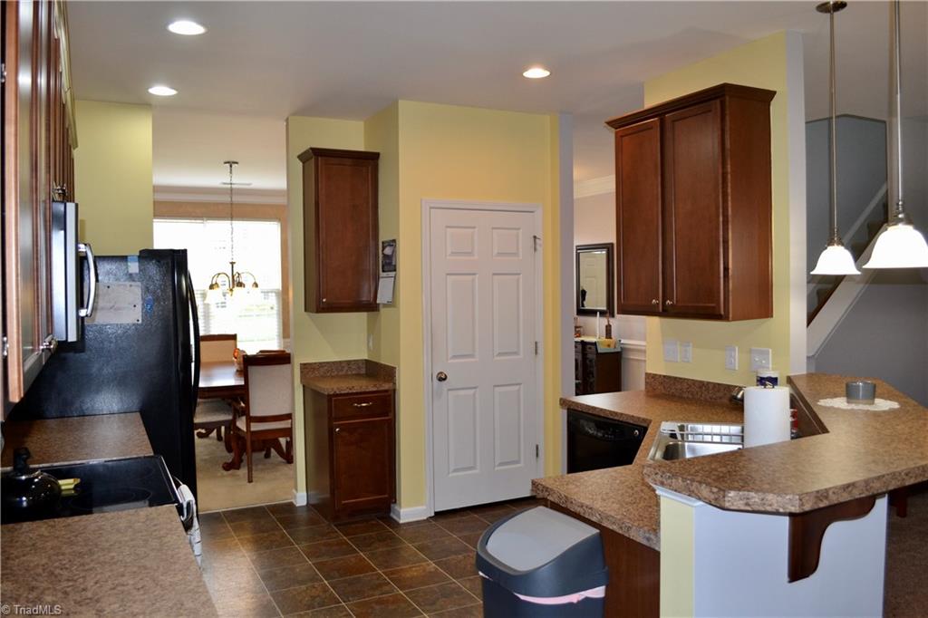 3068 Sycamore Point Trail High Point, NC 27265 - Photo 8 of 30 Convenient access to the dining room, large pantry, plenty of counter space