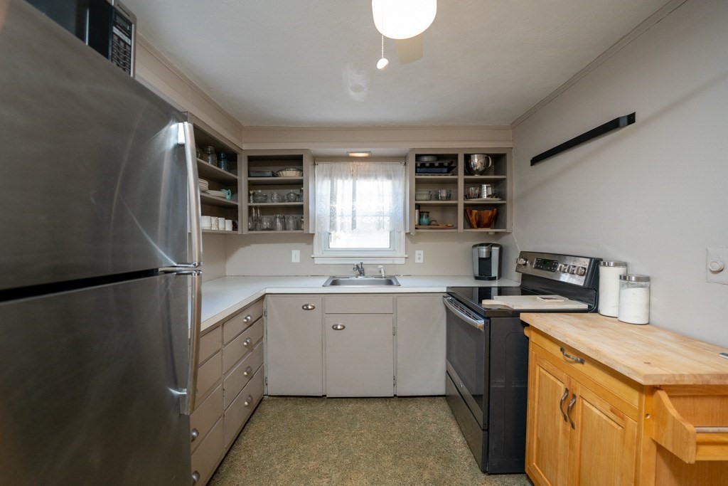 44 Hillside Avenue West Springfield, MA 01089 - Photo 15 of 34 a kitchen with stainless steel appliances white cabinets and a refrigerator