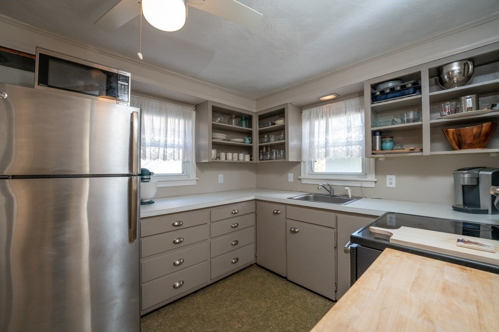 44 Hillside Avenue West Springfield, MA 01089 - Photo 16 of 34 a kitchen with a refrigerator sink and cabinets