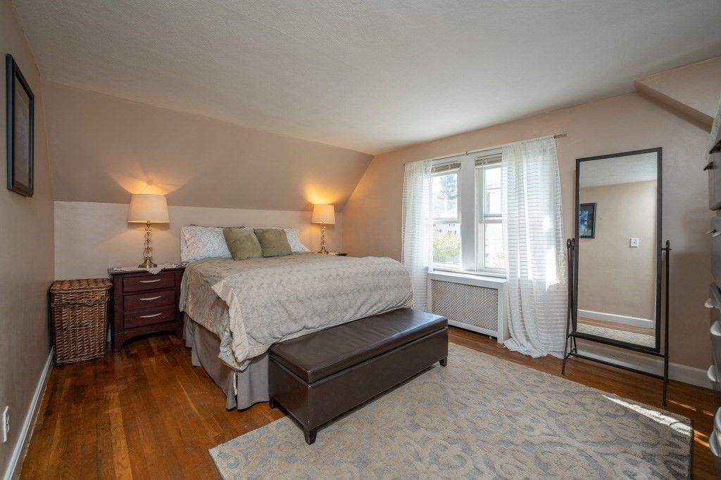 44 Hillside Avenue West Springfield, MA 01089 - Photo 24 of 34 a bedroom with a bed and wooden floor