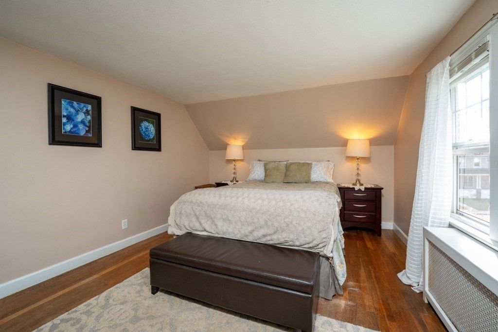 44 Hillside Avenue West Springfield, MA 01089 - Photo 25 of 34 a bedroom with a bed and wooden floor