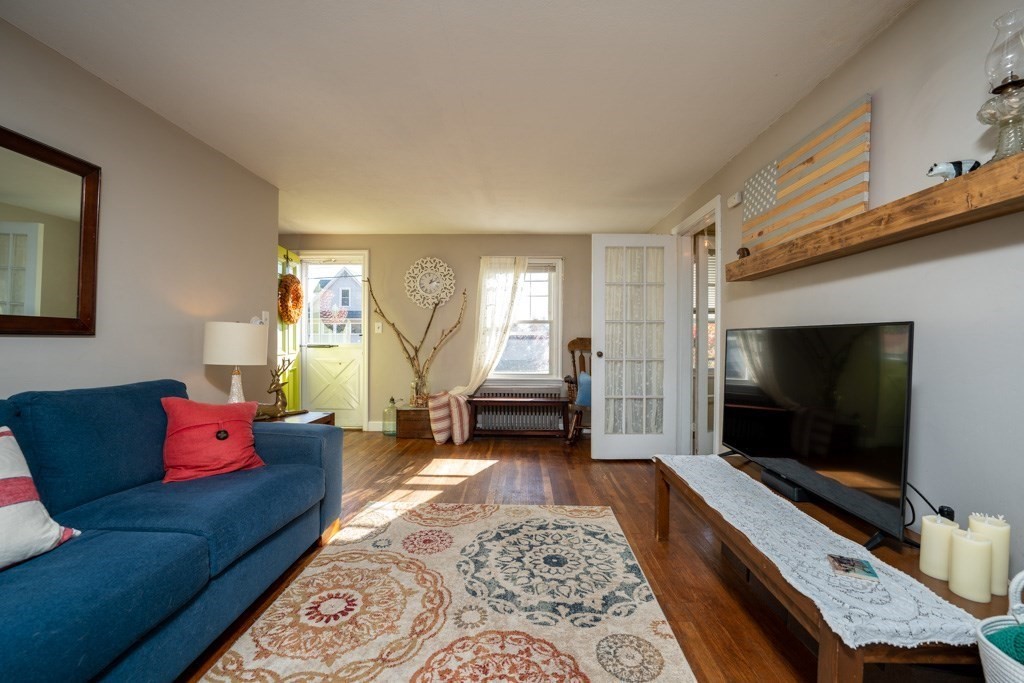 44 Hillside Avenue West Springfield, MA 01089 - Photo 10 of 34 a living room with furniture and a flat screen tv
