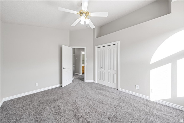 7 Reflection Way St. George, UT 84770 - Photo 37 of 54 Unfurnished bedroom with carpet flooring, a closet, and a ceiling fan