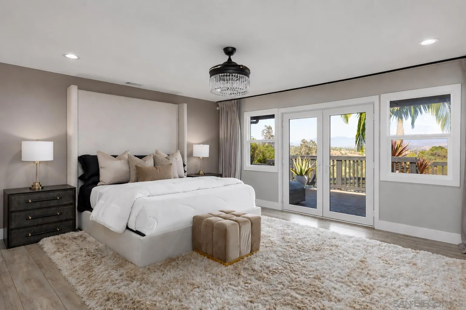 521 Rancho Camino Fallbrook, CA 92028 - Photo 25 of 72 a spacious bedroom with a large bed and a large window