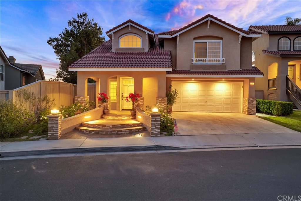17 Cagney Lake Forest, CA 92610 - Photo 1 of 1 a front view of a house with a yard
