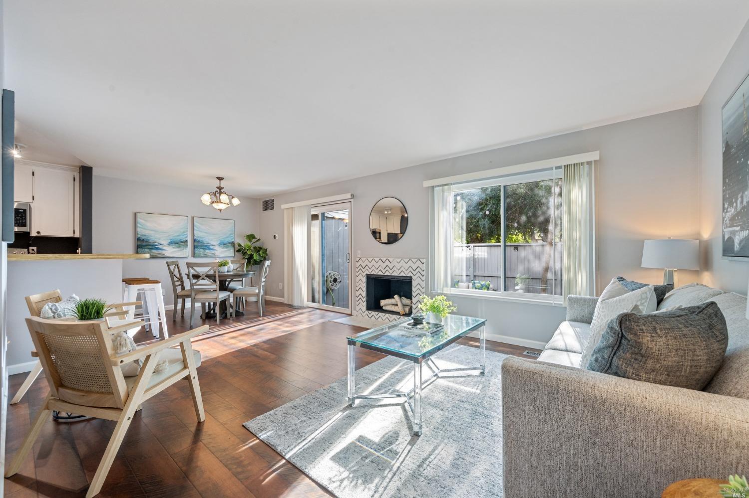 58 Scottsdale Way Novato, CA 94947 - Photo 1 of 1 a living room with furniture and a fireplace